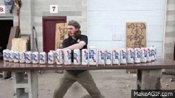 gif image of man slicing beer cans with sword